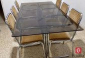 À Vendre : Table à manger en verre fumé + 6 chaises cantilever