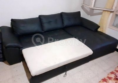 Grand canapé d’angle en cuir noir avec méridienne d’occasion