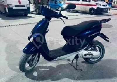 Yamaha Neos d'occasion bleu foncé vue de profil à Menzel Temime